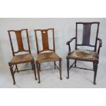 A set of five late C19th rush seated splat back chairs , raised on turned supports with pad feet