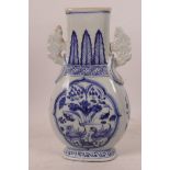 A Chinese blue and white porcelain two handled vase of flattened form, decorated with ducks on a