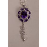 A silver, cubic zirconium and amethyst set pendant necklace with snake decoration, 2" drop