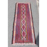 An antique Afghan Kilim rug, 111" x 44"