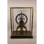 A brass skeleton mantel clock with two subsidiary dials, day/night aperture and glass case, 15½" x