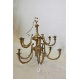 A brass two tier six branch chandelier, wired, 24" diameter