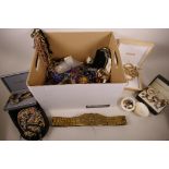 A large box of costume jewellery including a heavy Eastern brass link belt