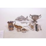 A hallmarked silver tankard, 52 grams, a silver dressing table set, two napkin rings and silver