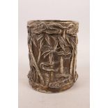A Chinese silvered metal brush pot with bamboo forest decoration, 4 character mark to base, 5" high