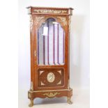 A Louis XV style tulipwood and walnut display cabinet, with brass mounts, raised on paw feet, 65"