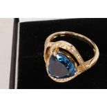 A 14ct yellow gold and diamond ring set with a heart shaped blue topaz, approximately 3.54 carat,