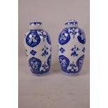 A pair of Chinese blue and white porcelain baluster jars and covers with floral decoration, 6