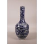 A Chinese blue and white porcelain bottle vase decorated with a phoenix amongst flowers, mark to