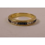 An 18ct gold, diamond and sapphire half eternity ring, approximate size 'P/Q'