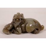 A Chinese carved celadon jade fo dog, 3½" long