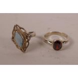 A silver garnet set ring and another