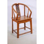 A Chinese fruitwood hoop backed side chair, with carved and parcel gilt panel back