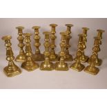 Six pairs of C19th brass ejector candlesticks, tallest 9¾"
