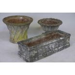 A reconstituted stone garden urn and stand, together with a garden planter and trough, trough 37"