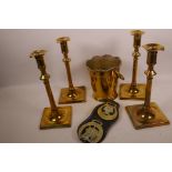 Four vintage brass candlesticks on square bases, together with a brass ice bucket and two horse