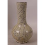 A Chinese crackle glazed porcelain bottle vase with yellow and black decoration, 7½" high