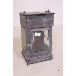 A C19th copper railway lantern, with three bevelled glass windows and copper reflector, stamped G.