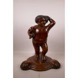 A Continental carved fruitwood figure of Bacchus, previously fitted for a light, 17" high