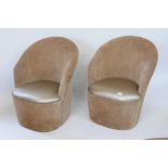 A pair of tub chairs with leatherette seats, by repute ex Stringfellows