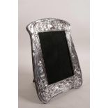 A hallmarked silver Art Nouveau style picture frame with an easel back (Birmingham 2002), aperture