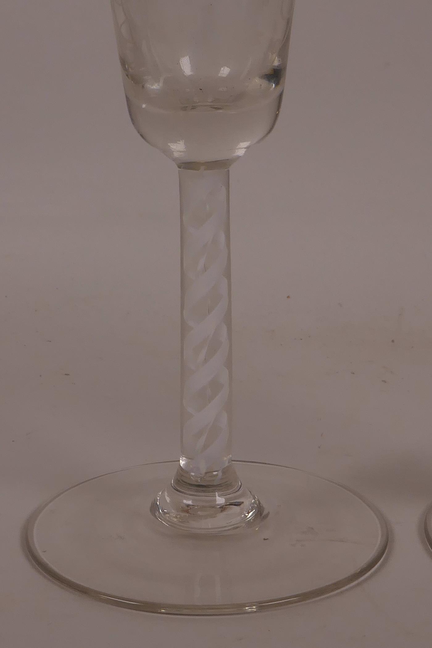 A pair of Georgian wine glasses with air twist stems and etched vine and bird decoration, 6½" high - Image 3 of 7