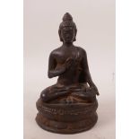 A Tibetan bronze of Buddha seated on a lotus throne, 5" high