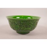 A Chinese green glazed porcelain bowl with raised dragon decoration, 6 character mark to base, 6"
