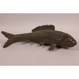 An Oriental bronze figurine of a carp, 11½" long