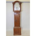 A C19th oak longcase clock with a two train movement, painted dial with floral decoration, Roman