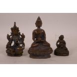 A collection of three small Sino-Tibetan bronze figures of Buddha and other deities, largest 4"