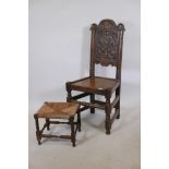 An Ipswich oak carved panel back chair, together with a rush seated stool, chair 40½" high