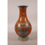 A Chinese polychrome porcelain pear shaped vase with enamelled decoration of floral arrangements