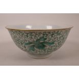 A Chinese porcelain rice bowl with green enamel scrolling lotus flower decoration, 6 character