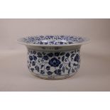 A large Chinese blue and white porcelain steep sided bowl decorated with lotus flowers and
