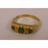 An 18ct gold emerald and diamond ring, size 'Q/R', gross 3.8 grams