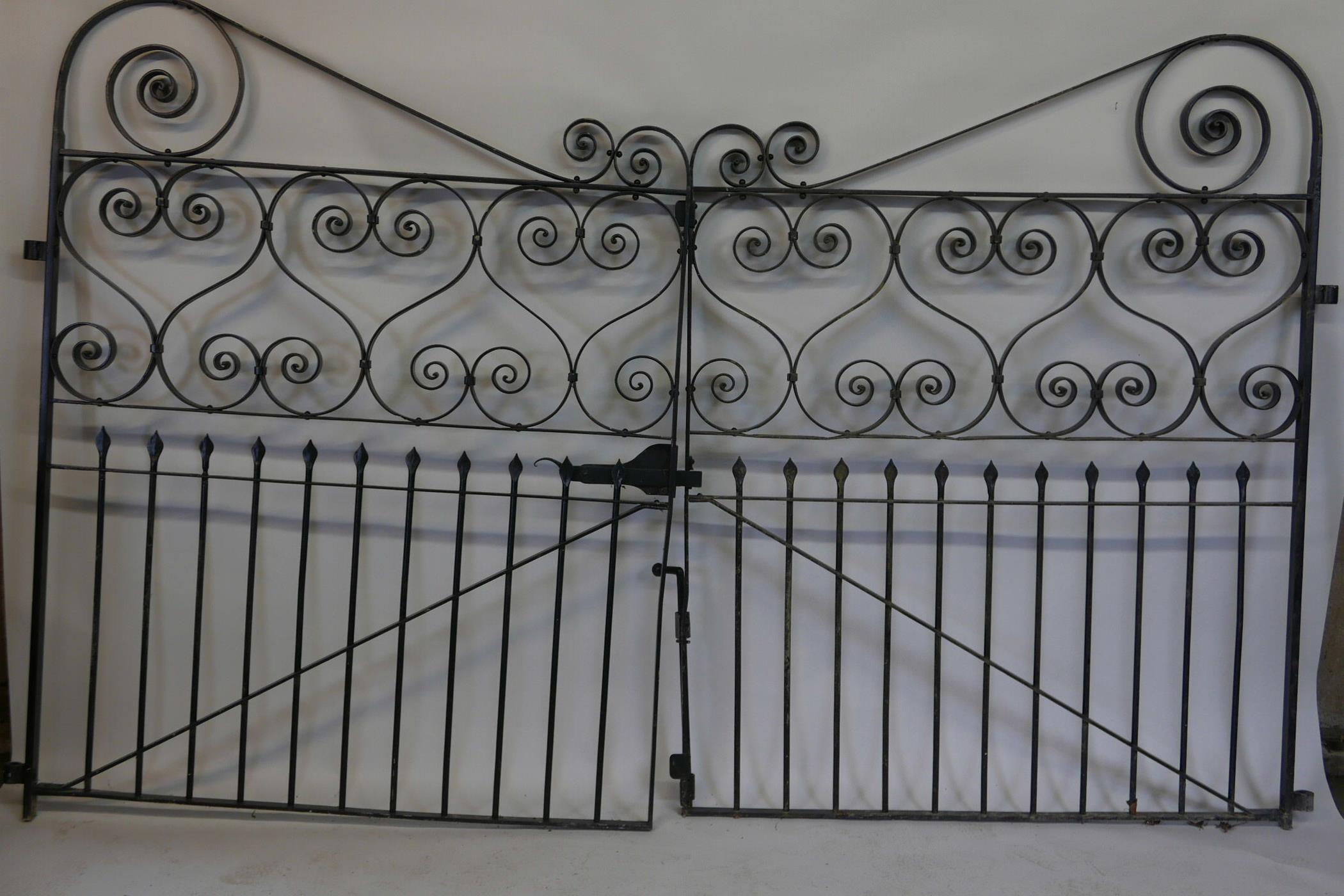 A pair of large wrought metal gates, 48" x 62"