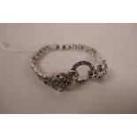 A 925 silver and marcasite encrusted bracelet decorated with two panther heads, 7" long