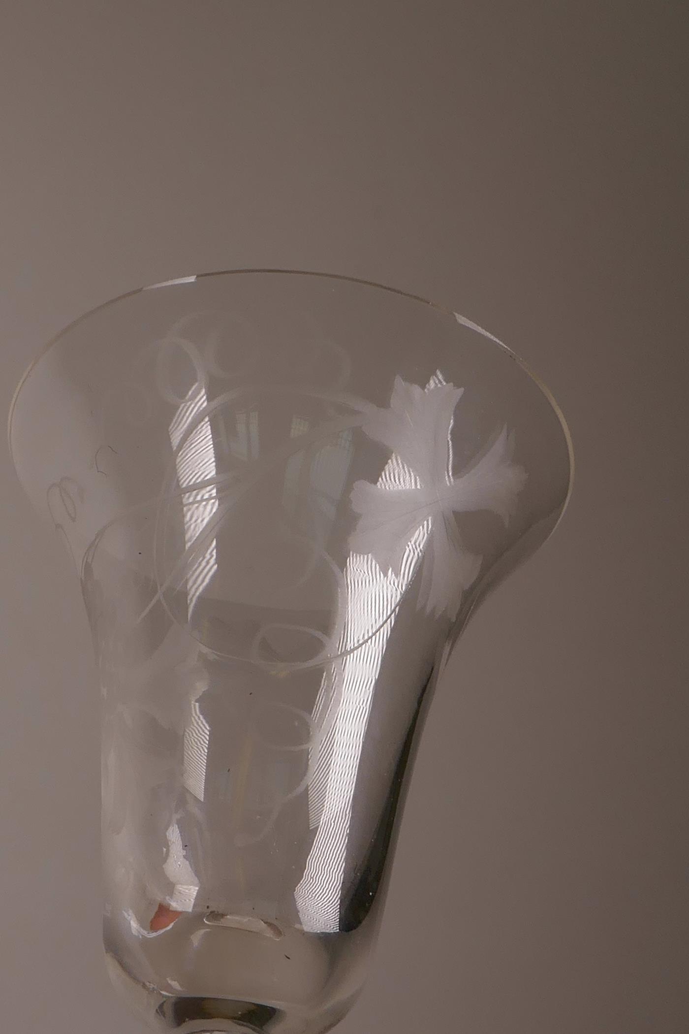 A pair of Georgian wine glasses with air twist stems and etched vine and bird decoration, 6½" high - Image 5 of 7