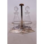 An Art Deco silver plated cruet with two crystal bottles, stamped D. Gallia, for Christofle, 8" high