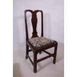 An C18th walnut and fruitwood splat back side chair, with drop in tapestry seat, raised on square
