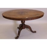 A C19th oval topped loo table raised on a turned column and cabriole supports, 52" x 40"