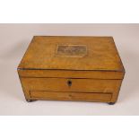 A Victorian yew wood veneered sewing box with ebony banding, the fitted interior and base drawer