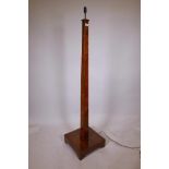 An Art Deco burr walnut standard lamp with beaded edges on a platform base, 16" x 16", 67" high