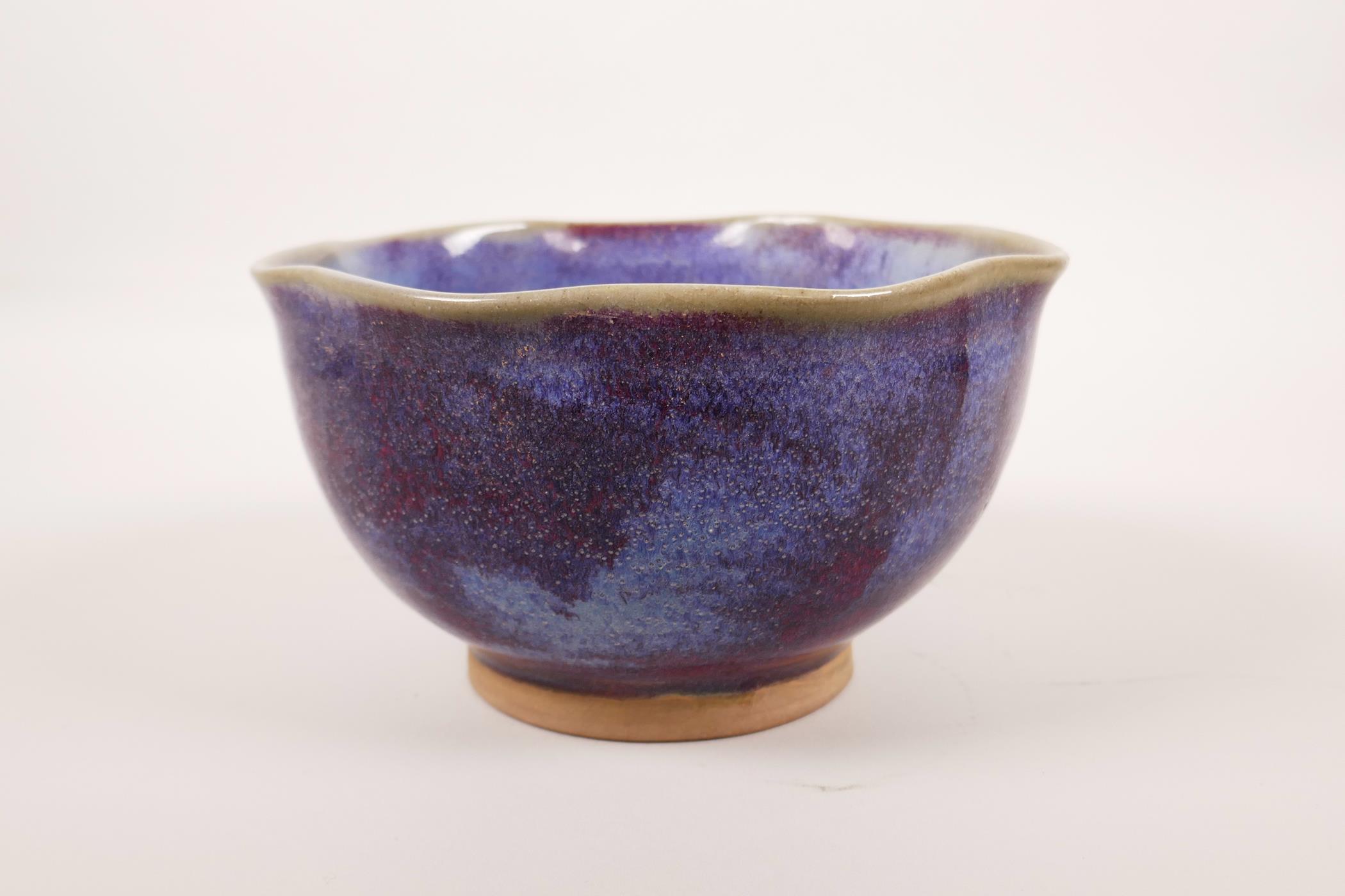 A Chinese Jun ware pottery bowl with a frilled rim, 6½" diameter