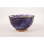 A Chinese Jun ware pottery bowl with a frilled rim, 6½" diameter