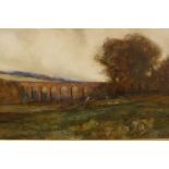 Figure by a viaduct, indistinctly signed, watercolour 16" x 25"