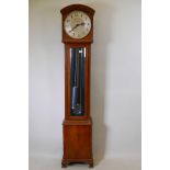 An Art Deco walnut longcase clock, with brushed steel dial and Arabic numerals, inscribed Enfield,