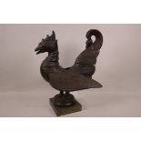 An antique Persian carved wood bird on stand, 13½" high