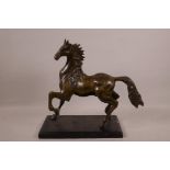 A bronze figure of a prancing horse, 13" long, 11" high